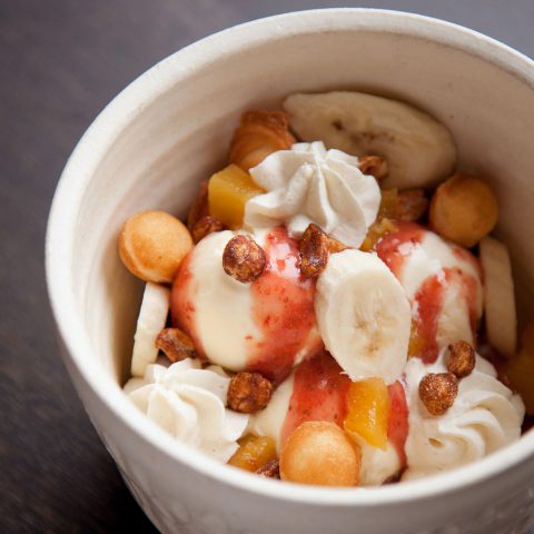 Bubble Waffle Sundae For Two with banana ice cream, roasted pineapple and soy peanuts at DanDan in Milwaukee, Wisconsin. Photo by Kevin J. Miyazaki/PLATE